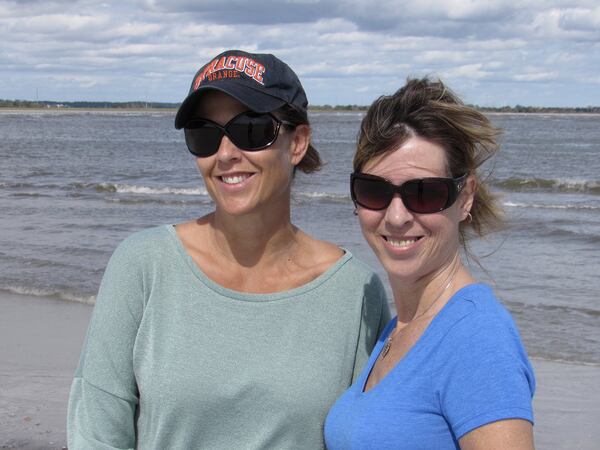 Christine Savoie, left, and Kimberly Eby both support President Donald Trump and oppose the impeachment inquiry. “People have always disagreed on politics. But after elections, we used to come together,” Savoie said. “When I was growing up we stood behind our president.” (Bert Roughton for The Atlanta Journal-Constitution.