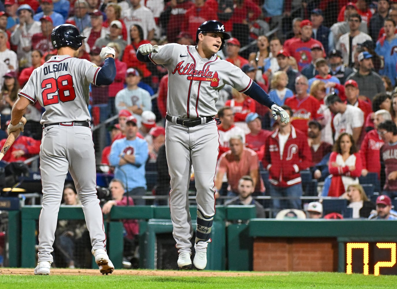 Atlanta Braves’ Austin Riley celebrates with Matt Olson (28) after a solo home run against the Philadelphia Phillies during the fourth inning of NLDS Game 4 at Citizens Bank Park in Philadelphia on Thursday, Oct. 12, 2023.   (Hyosub Shin / Hyosub.Shin@ajc.com)