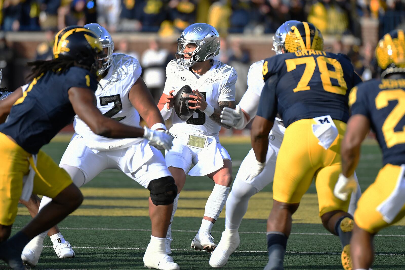 Oregon quarterback Dillon Gabriel (8) looks to pass against Michigan in the first half of an NCAA college football game, Saturday, Nov. 2, 2024, in Ann Arbor, Mich. (AP Photo/Jose Juarez)