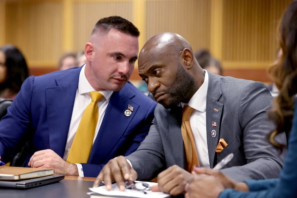 Will Wooten, Deputy Fulton County DA, (Left), and special prosecutor Nathan Wade talk during a court hearing in front of Fulton Superior Court Judge Scott McAfee in Atlanta on Friday, January 19, 2023 (Jason Getz/jason.getz@ajc.com)