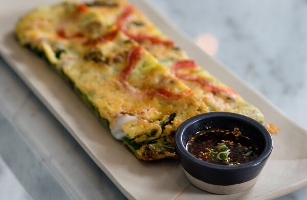 The seafood pancake is a savory side dish at Ari Korean Steakhouse. CONTRIBUTED BY HENRI HOLLIS