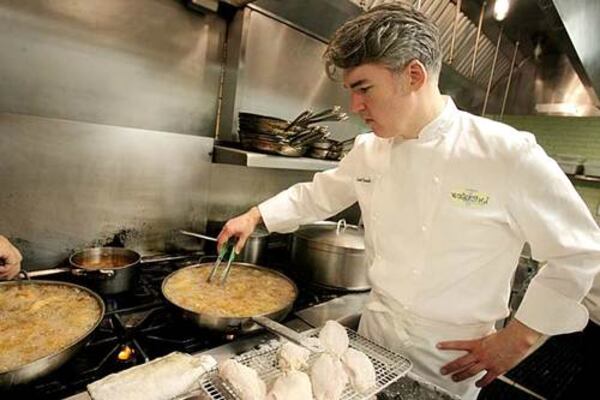 Executive chef Scott Peacock prepares Watershed's buttermilk fried chicken in the kitchen of the Decatur restaurant.