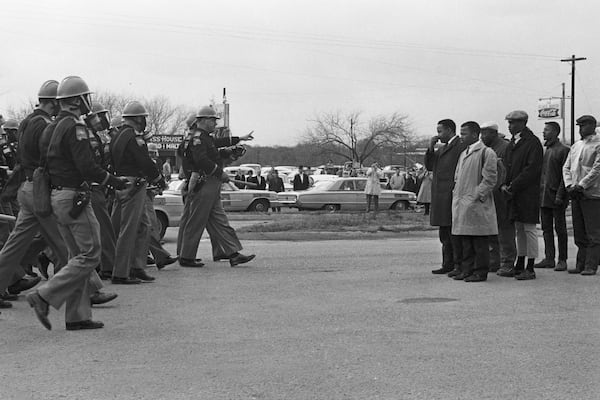 Congressman John Lewis (right side, with tan coat) and Hosea Williams are shown moments before they were attacked by Alabama state troopers on March 7, 1965. It’s a day that would be known as “Bloody Sunday.” CONTRIBUTED BY MAGNOLIA PICTURES