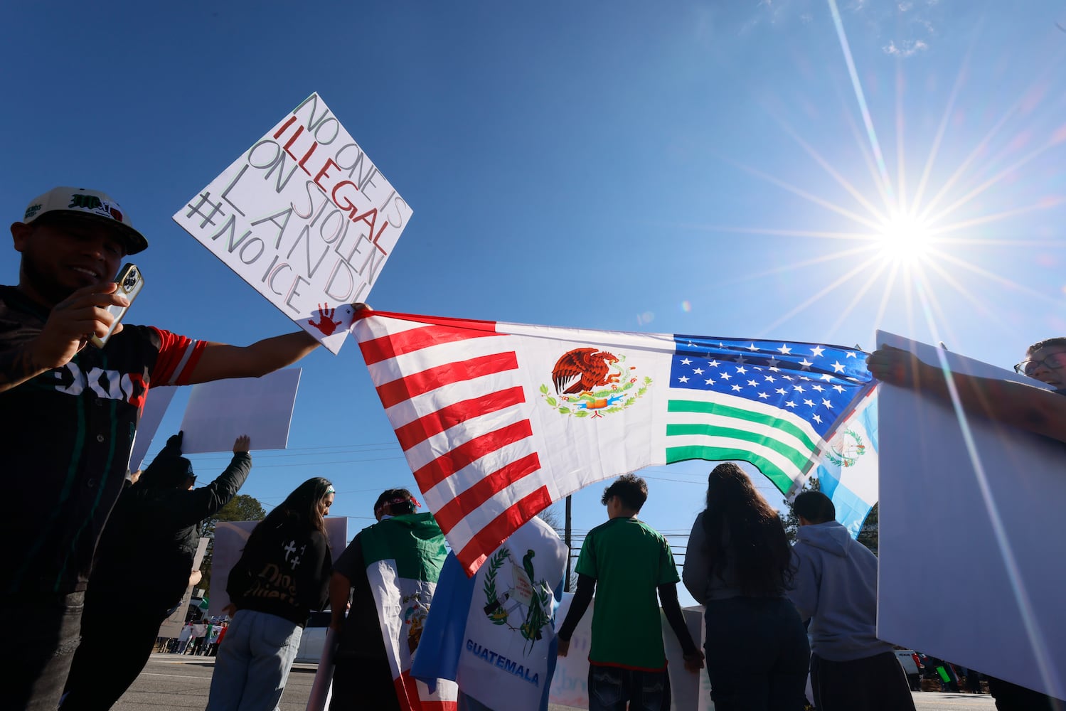 Sergio Rodriguez from Jonesboro holds a Mexican-American at Plaza Fiesta to participate in a peaceful protest supporting immigrants on Saturday, February 1, 2025, in response to a recent immigration arrest in Georgia.
(Miguel Martinez/ AJC)