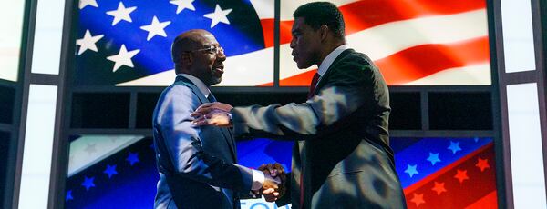 Sen. Raphael Warnock (D-Ga.) shakes hands with Republican candidate Herschel Walker prior to the Nexstar Georgia Senate Debate at District Live at Plant Riverside District in Savannah, Ga., on Friday, October 14, 2022.