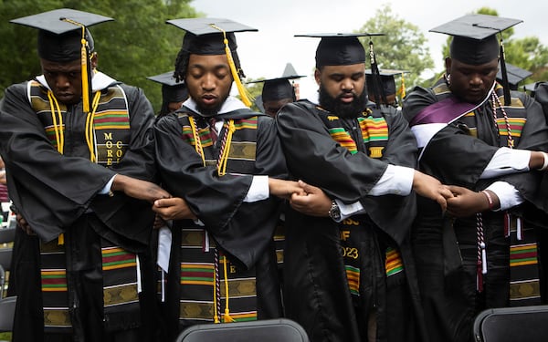 Members of the Morehouse class of 2023 sing their college anthem during the Morehouse College commencement ceremony on Sunday, May 21, 2023, on Century Campus in Atlanta. The graduation marked Morehouse College's 139th commencement program. (AJC 2023)