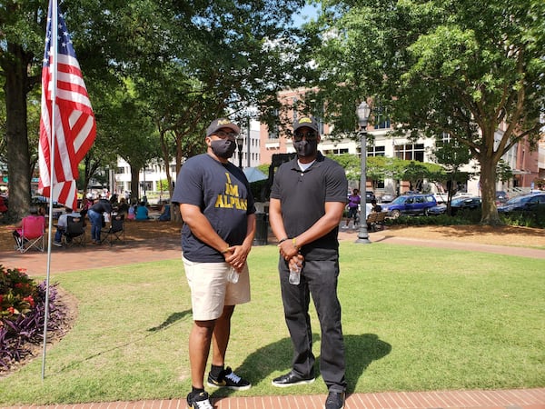 Friends James Ford and Willie Robinson attend the Cobb NAACP Juneteenth observance Friday June 19, 2020 at Marietta Square. KRISTAL DIXON / AJC