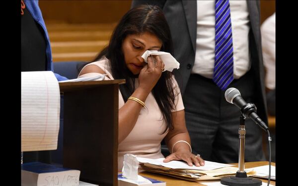 Parneeta Sidhu, wipes away tears during statement at the sentencing of Lishan Wang at New Haven Superior Court Friday, Sept. 22, 2017, in New Haven, Connecticut. Wang is the man who killed her husband.