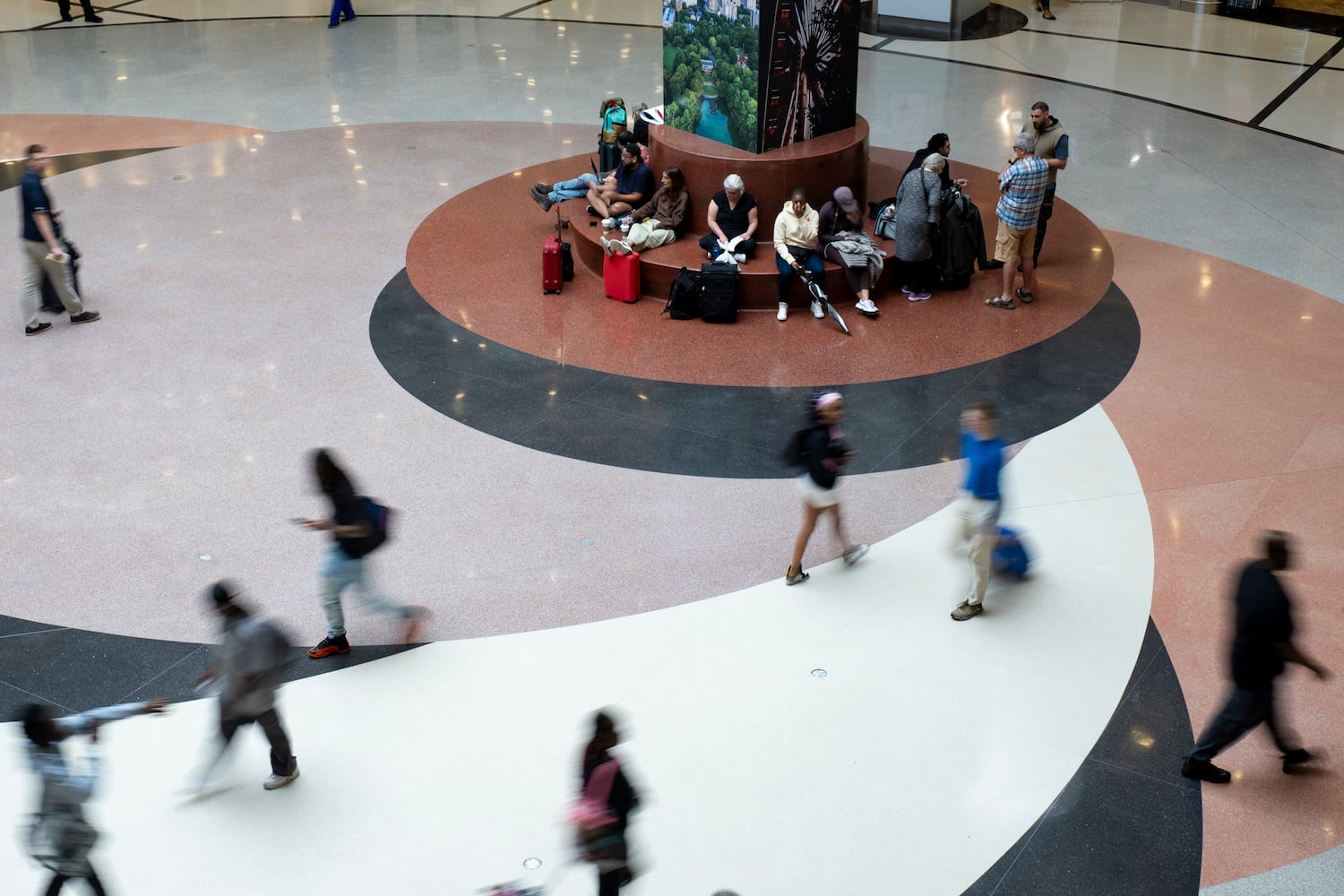 Crowds were thin in the atrium at Hartsfield Jackson International Airport on Thursday, Sept. 26, 2024 even before Hurricane Helene’s anticipated arrival.   Ben Gray for the Atlanta Journal-Constitution