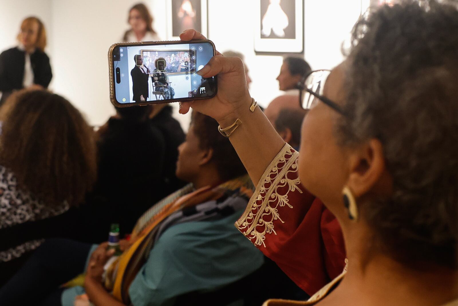 Photographer Susan “Sue” Ross ltakes a photograph of photographer Renee Cox at UTA Artist Space in Atlanta on Thursday, Feb. 22, 2024. (Natrice Miller/ Natrice.miller@ajc.com)