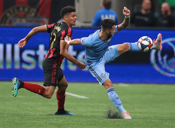 August 11, 2019 Atlanta: Atlanta United defender Miles Robinson defends against New York City FC forward Valentin Castellanos in their soccer match on Sunday, August 11, 2019, in Atlanta.   Curtis Compton/ccompton@ajc.com