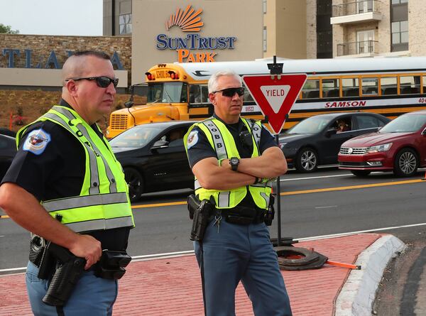 Cobb County is paying overtime to police who volunteer for traffic control duty at SunTrust Park. CURTIS COMPTON/CCOMPTON@AJC.COM