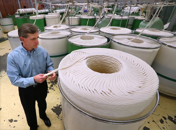 Marty Moran, the CEO of Buhler Yarns in Jefferson, Ga., and the chairman of the trade organization the National Council for Textile Organizations, said automation has been key for the survival of the textile industry in Georgia and the U.S. Automation helps U.S. factories compete with foreign factories. Curtis Compton/ccompton@ajc.com