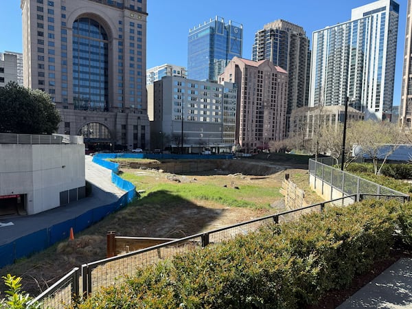 This construction site along 14th Street in Midtown Atlanta had been slated for a new symphony hall and later a high-rise residential development called Opus Place. On Tuesday, March 18, 2025, the Midtown Alliance said it will develop a park on the property. (Mirtha Donastorg/AJC)