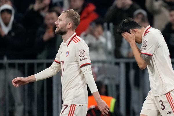 Bayern's Kim Min-jae, right, reacts after scoring the opening goal during the Champions League opening phase soccer match between FC Bayern and Paris Saint Germain, at the Allianz Arena in Munich, Germany, Tuesday, Nov. 26, 2024.(AP Photo/Matthias Schrader)