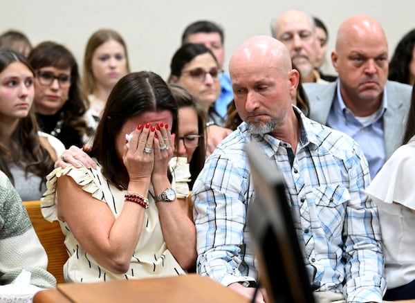 CORRECTS IDENTIFICATION TO LAKEN RILEY'S FAMILY - Allyson Phillips, second from left, mother of Laken Riley reacts as John Phillips, stepfather of Laken Riley, comforts her during a trial of Jose Ibarra, accused of killing the Georgia nursing student earlier this year, at Athens-Clarke County Superior Court, Friday, Nov. 15, 2024, in Athens, Ga. (Hyosub Shin/Atlanta Journal-Constitution via AP, Pool)