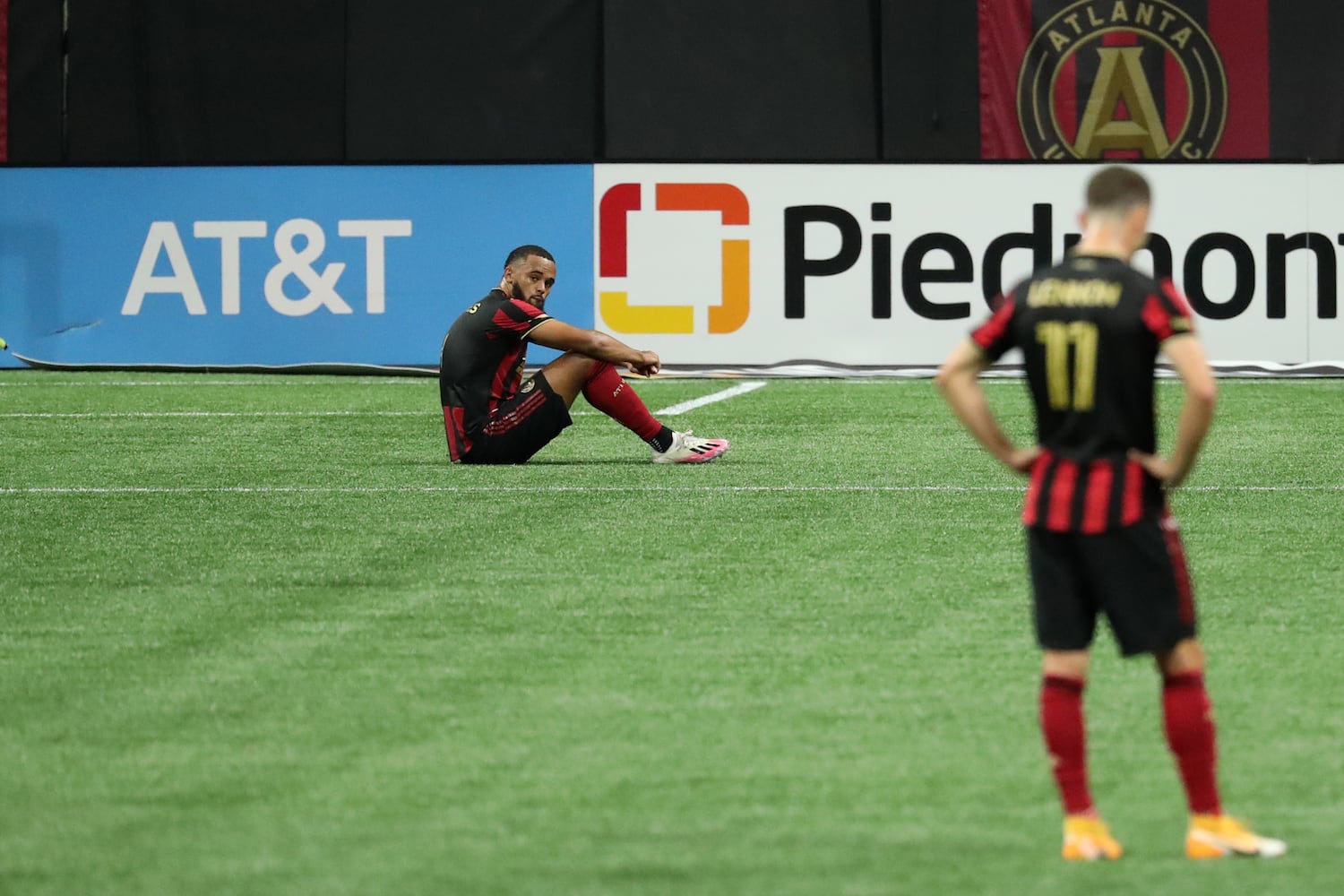 Atlanta United defenders Anton Walkes, left, and Brooks Lennon (11) react after their 2-1 loss to Miami at Mercedes-Benz Stadium Saturday, September 19, 2020 in Atlanta. JASON GETZ FOR THE ATLANTA JOURNAL-CONSTITUTION