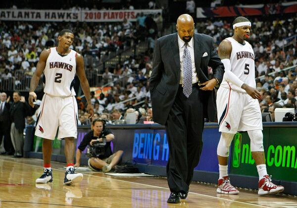 Atlanta Hawks head coach Mike Woodson, guard Joe Johnson (2), and forward Josh Smith (5) head to the bench for a time out during the second half of a 105-75 loss to the Orlando Magic in game 3 of the  Eastern Conference semifinals Saturday, May 8, 2010, at Philips Arena in Atlanta. (Curtis Compton/ccompton@ajc.com)