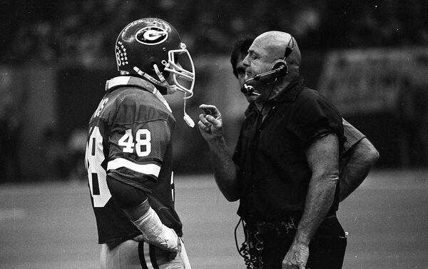 Linebacker Frank Ros talks to defensive coordinator Erk Russell in `1980. 