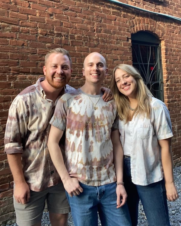 Craene Studio + Archive turns thrift store garments into hand-dyed upcycled fashion. Shown here (left to right) Steven DeCraene, Corey DeCraene, Caroline Hust.
(Courtesy of Craene Studio and Archive)