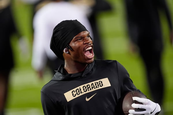 FILE - Colorado wide receiver Travis Hunter (12) reacts as he warms up before an NCAA college football game against Saturday, Oct. 12, 2024, in Boulder, Colo. (AP Photo/David Zalubowski, File)