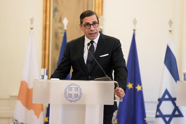 Cyprus' Foreign Minister Constantinos Kombos, speaks during a news conference and after trilateral meeting with Greece and Israel on energy cooperation in Athens, Thursday, March 13, 2025. (AP Photo/Petros Giannakouris)