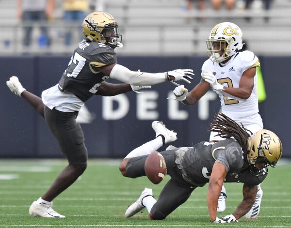 September 19, 2020 Atlanta - University of Central Florida's defensive back Richie Grant (27) and University of Central Florida's defensive back Aaron Robinson (31) try to block a pass intended to Georgia Tech's wide receiver Ahmarean Brown (2) during the second half of an NCAA college football game at Georgia Tech's Bobby Dodd Stadium in Atlanta on Saturday, September 19, 2020. UCF won 49-21 over the Georgia Tech. (Hyosub Shin / Hyosub.Shin@ajc.com)