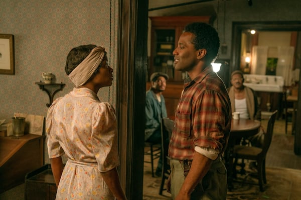 This image released by Netflix shows Danielle Deadwyler, left, and John David Washington in a scene from "The Piano Lesson." (David Lee/Netflix via AP)