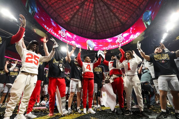 Ohio State players sing the school song as they celebrate after their 34-23 win against Notre Dame in the 2025 National Championship at Mercedes-Benz Stadium, Monday, Jan. 20, 2025, in Atlanta. (Jason Getz / AJC)