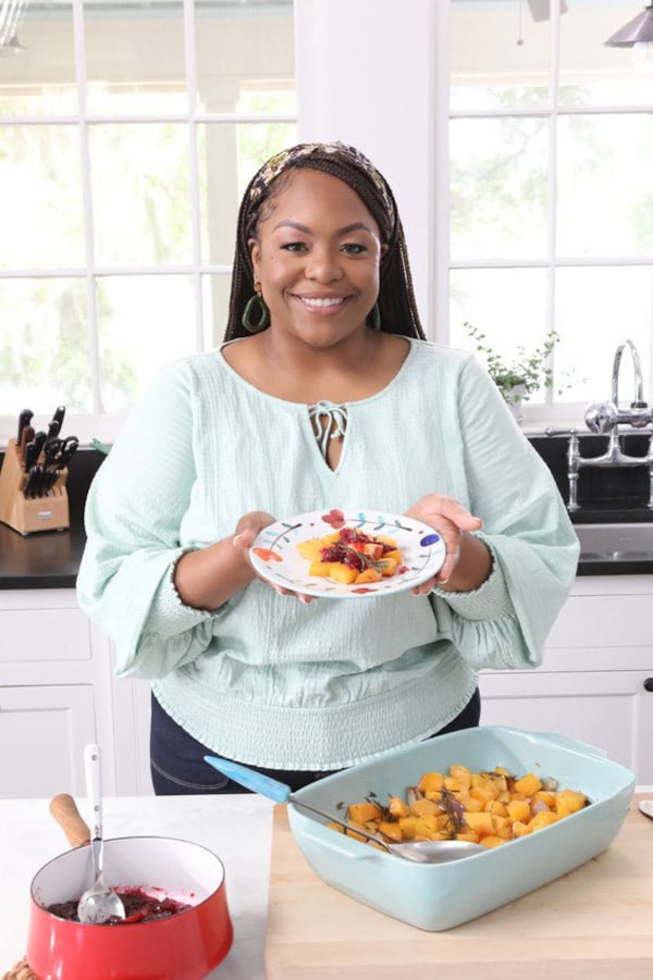 Kardea Brown, who spent her formative years in Atlanta and Charleston, S.C., pays homage to her Gullah-Geechee roots on the Food Network series "Delicious Miss Brown" and now in her first cookbook, "The Way Home: A Celebration of Sea Islands Food and Family With Over 100 Recipes" (Amistad, $34.99). (Courtesy of Sully Sullivan)