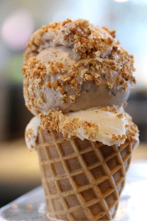 A customer favorite is Honeysuckle Gelato's brown butter gelato. Here it's served in a cone topped with honey fig gelato and sprinkled with amaretti crumbles.