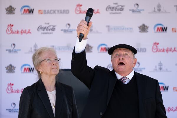 Clyde Strickland gives testimony with his wife, Sandra, by his side during the unveiling ceremony for a statue of the Rev. Martin Luther King Jr. in Rodney Cook Sr. Peace Park in Atlanta on Saturday, April 1, 2023. (Ben Gray / Ben@BenGray.com)