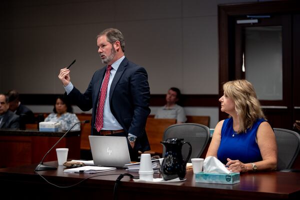 Attorney Chuck Boring, seen here in June with clilent Alicia Adams, called Cobb's recent decision to intervene “absurd and offensive.” (Ben Hendren for the Atlanta Journal-Constitution)