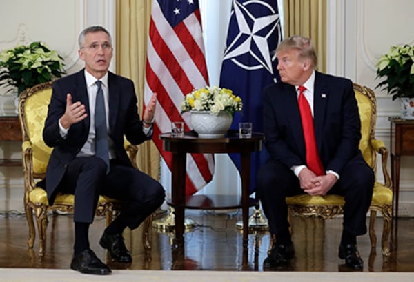 President Donald Trump meets NATO Secretary General Jens Stoltenberg on Tuesday at Winfield House in London.