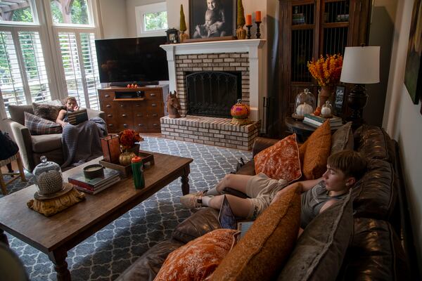 Howard Middle School eighth grader Jack Jenkins (right) and Jude Paulson (left) participate in virtual learning while hanging out in a learning pod at Jack's house in Atlanta on Friday, August 28, 2020. (Alyssa Pointer / Alyssa.Pointer@ajc.com)