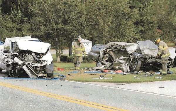 The aftermath of the crash that injured Jimmy Shackelford shows the damage to his white pickup at left and the Gold Mercury Grand Marquis that struck him, at right. Shackelford suffered a fractured sternum, four broken ribs and a bruised lung, and his foot was broken in several places. (Superior Court of Baldwin County)