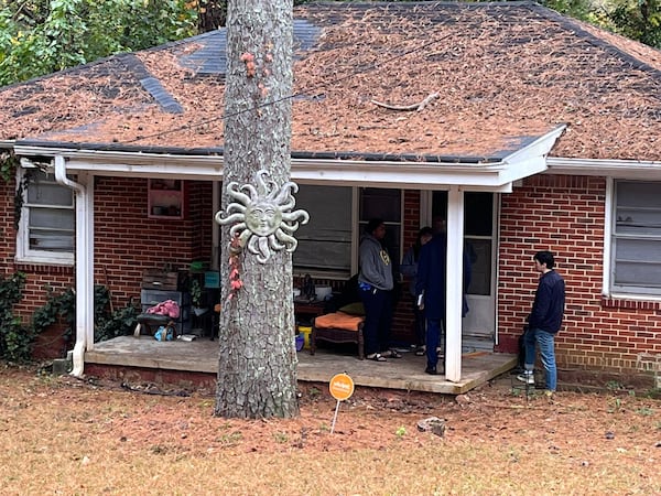 U.S. Sen. Raphael Warnock, doing some canvassing on his own, visits a south DeKalb home to chat with voters. “I’m enjoying this," said Warnock, who is also the senior pastor at Ebenezer Baptist Church in Atlanta. "And, you know, it’s similar to being the pastor — you spend time with the flock.”