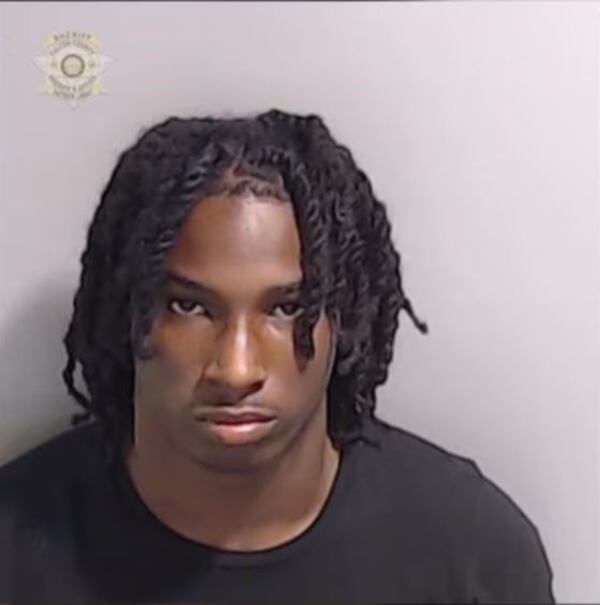 Shoun Bilal, 18, was arrested after turning himself in at the Fulton County Jail on charges related to killing two people and injuring a third on June 20, officials said.