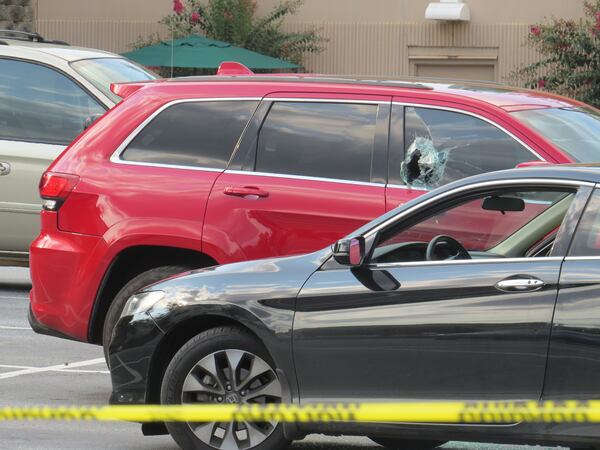 A bullet hole could be seen in the passenger window of the Jeep.