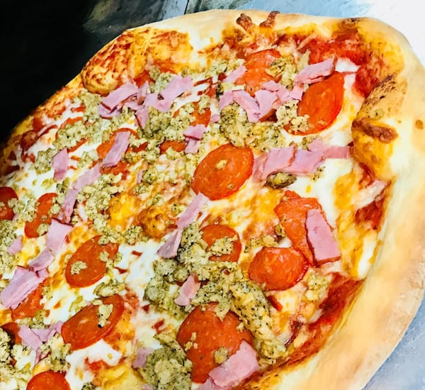 Bakaris Plant-Based Pizza serves a vegan meat deluxe that includes pepperoni made from Beyond meat and Impossible meat, plus vegan bacon. (Courtesy of Bakaris Plant-Based Pizza)