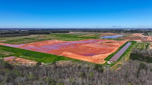 An aerial perspective of the Rivian Plant reveals slight activity among the heavy machinery following the corporation's recent announcement to suspend the extensive construction work at its Georgia site on Tuesday, March 19, 2024. (Miguel Martinez/AJC)