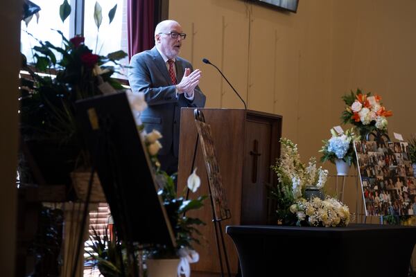 The Rev. Michael McCullar gives the eulogy while officiating a memorial service for Jonathan Erik Locke in Peachtree Corners on Saturday, July 27, 2024.  (Ben Gray for the AJC)