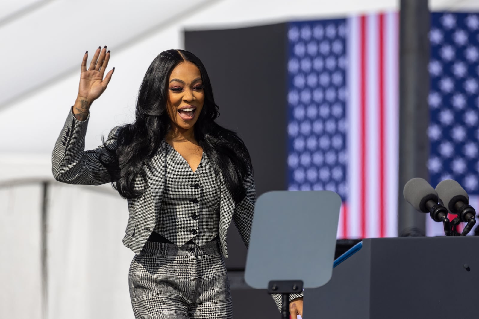 Singer Monica speaks at Democratic presidential candidate Kamala Harris’ campaign rally at the Atlanta Civic Center parking lot in Atlanta on Saturday, November 2, 2024. (Arvin Temkar / AJC)