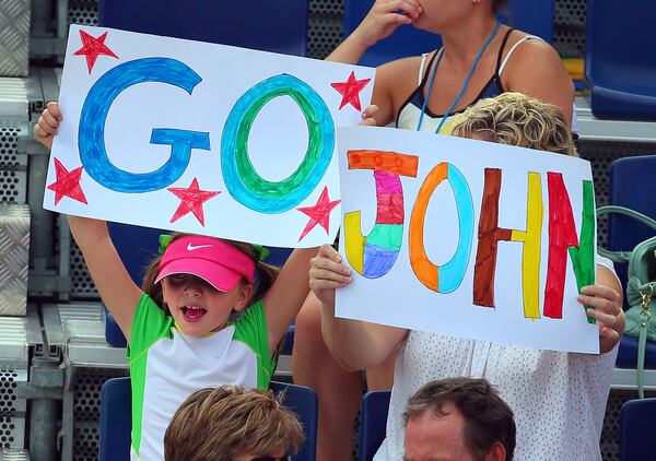 Fans show support for John Isner, who defeated Lleyton Hewitt 6-4, 4-6, 7-6 (5) to win the semi-finals match and advance to the final at the BB&T Atlanta Open in 2013. CURTIS COMPTON / CCOMPTON@AJC.COM