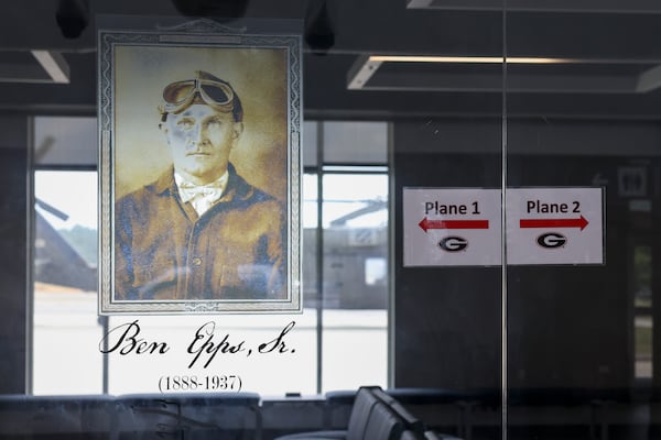 Historical photographs of Ben Epps, Georgia’s first aviator, is shown inside the domestic terminal at the Athens Ben Epps Airport, Wednesday, Sept. 25, 2024. (Jason Getz / AJC)

