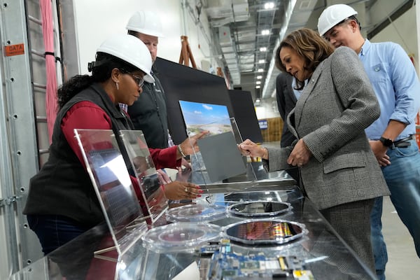 Democratic presidential nominee Vice President Kamala Harris, right, tours the Hemlock Semiconductor Next-Generation Finishing facility in Hemlock, Mich., Monday, Oct. 28, 2024. (AP Photo/Jacquelyn Martin)