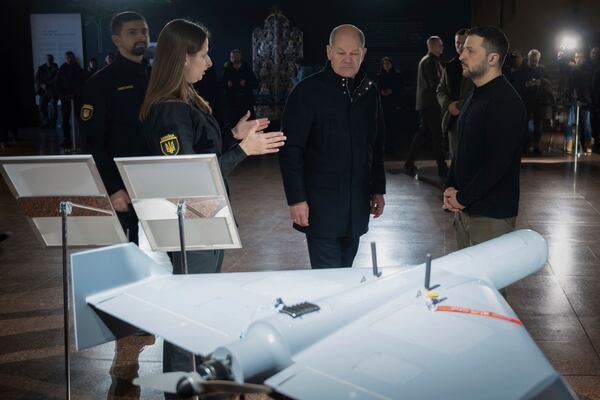 In this photo provided by the Ukrainian Presidential Press Office, Ukraine's President Volodymyr Zelenskyy, front right, and German Chancellor Olaf Scholz, front second right, take a look at drones during Scholz's visit to Kyiv, Ukraine, Monday, Dec.2, 2024. (Ukrainian Presidential Press Office via AP)