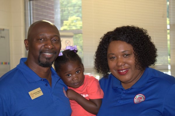 Chris and Ty Woods, pictured with daughter Amber, started ARTportunity Knocks, a thriving nonprofit dedicated to empowering students in the arts and encouraging community service. (Courtesy of Nichole Maxwell)