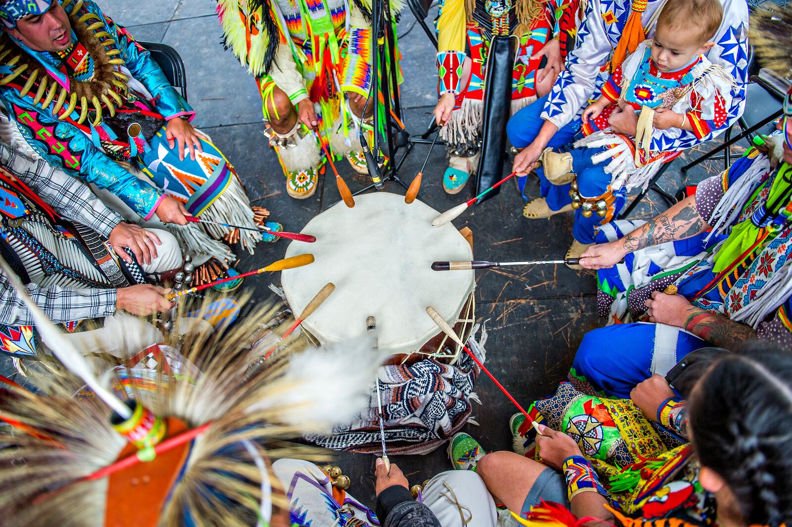 October 31, 2015 Stone Mountain - Charles Backus (top left) plays a ceremonial drum with the Silver Ridge Singers during the Indian Festival & Pow Wow at Stone Mountain Park on Saturday, October 31, 2015. The four day festival showcases Native American culture through dance, music, authentic craft demonstrations, cooking traditions, storytelling, wildlife presentations and more. JONATHAN PHILLIPS / SPECIAL