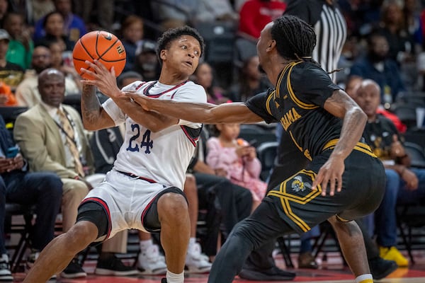 Jackson State guard Daeshun Ruffin (24) fights for possession against Alabama State during the first half of an NCAA basketball game in the championship of the Southwest Athletic Conference Championship tournament on Saturday, March 15, 2025, in College Park, Ga. (AP Photo/Erik Rank)